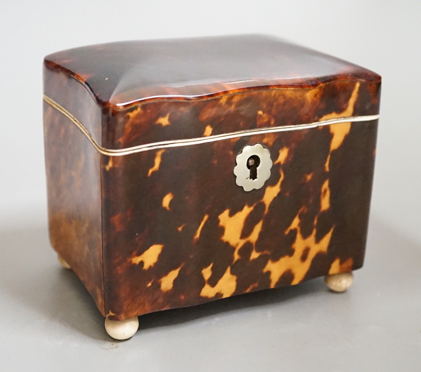 A rare small 19th century tortoiseshell and ivory mounted tea caddy, 9cms wide x 10cms high